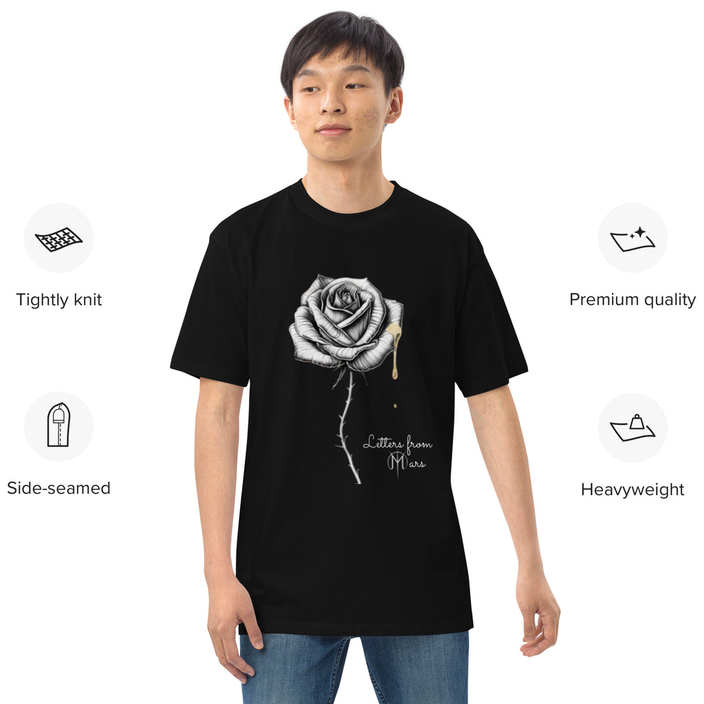 Person wearing a black t-shirt with a Letters from mars rose design on a white background