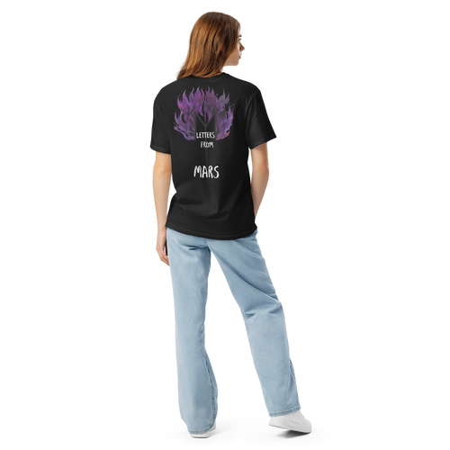 Person wearing a black t-shirt with a purple Letters from mars M logo graphic and text on the back, standing against a white background.