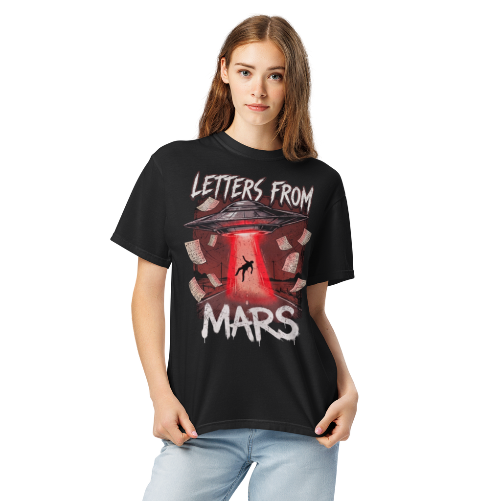 Person wearing a black t-shirt with 'Letters from Mars' graphic design on a white background