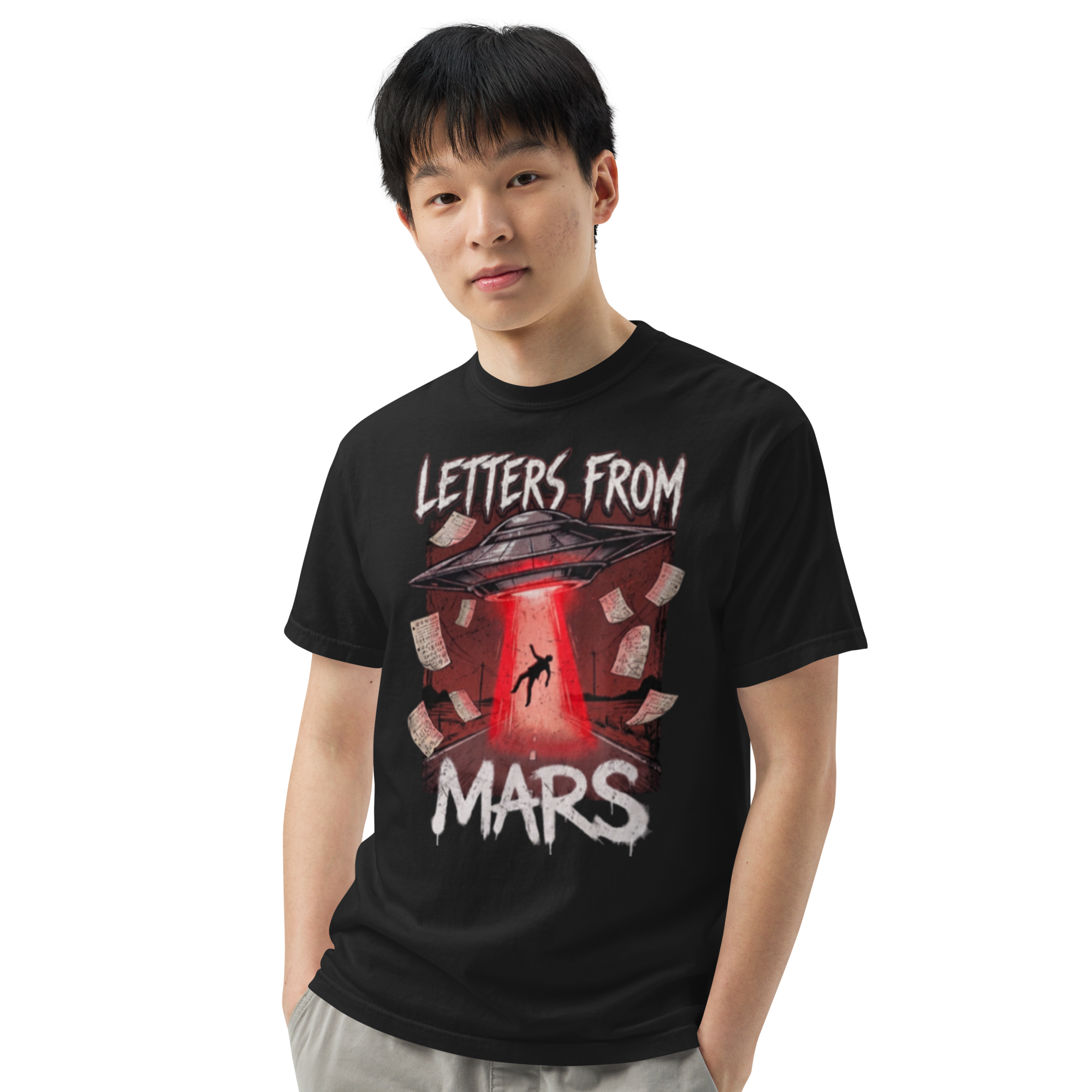 Person wearing a black t-shirt with 'Letters from Mars' graphic design on a white background